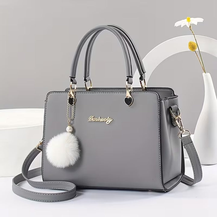 Sanika - Handbag With Pom-Pom Charm and Shoulder Strap